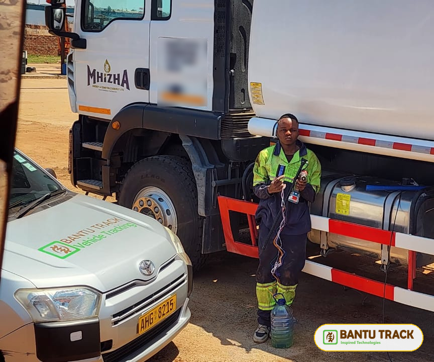 Fuel tracker installation on a truck with the technician